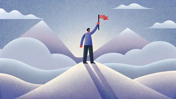 Homme plantant un drapeau au sommet d'une montagne, atteindre ses ambitions